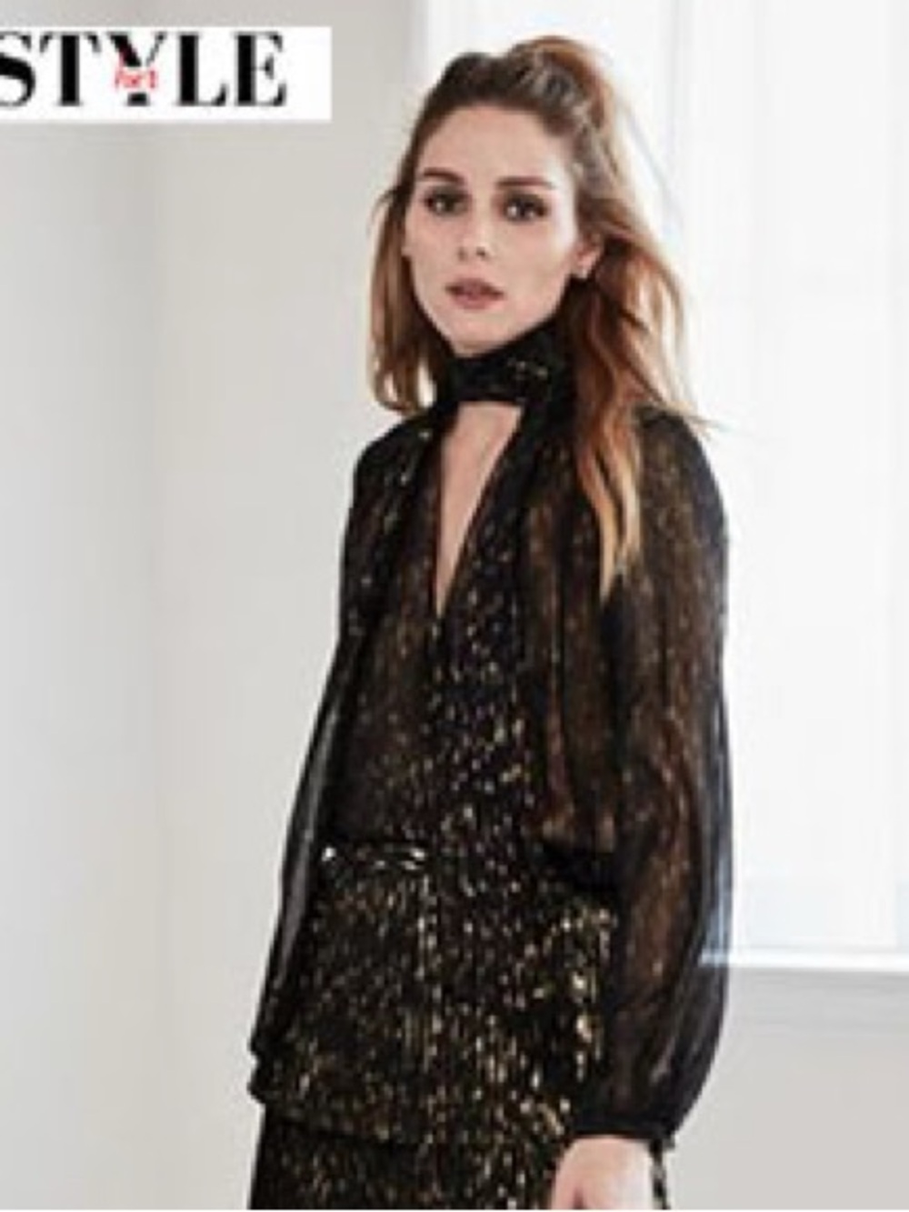 Olivia Palermo sheer black and gold bow tie blouse